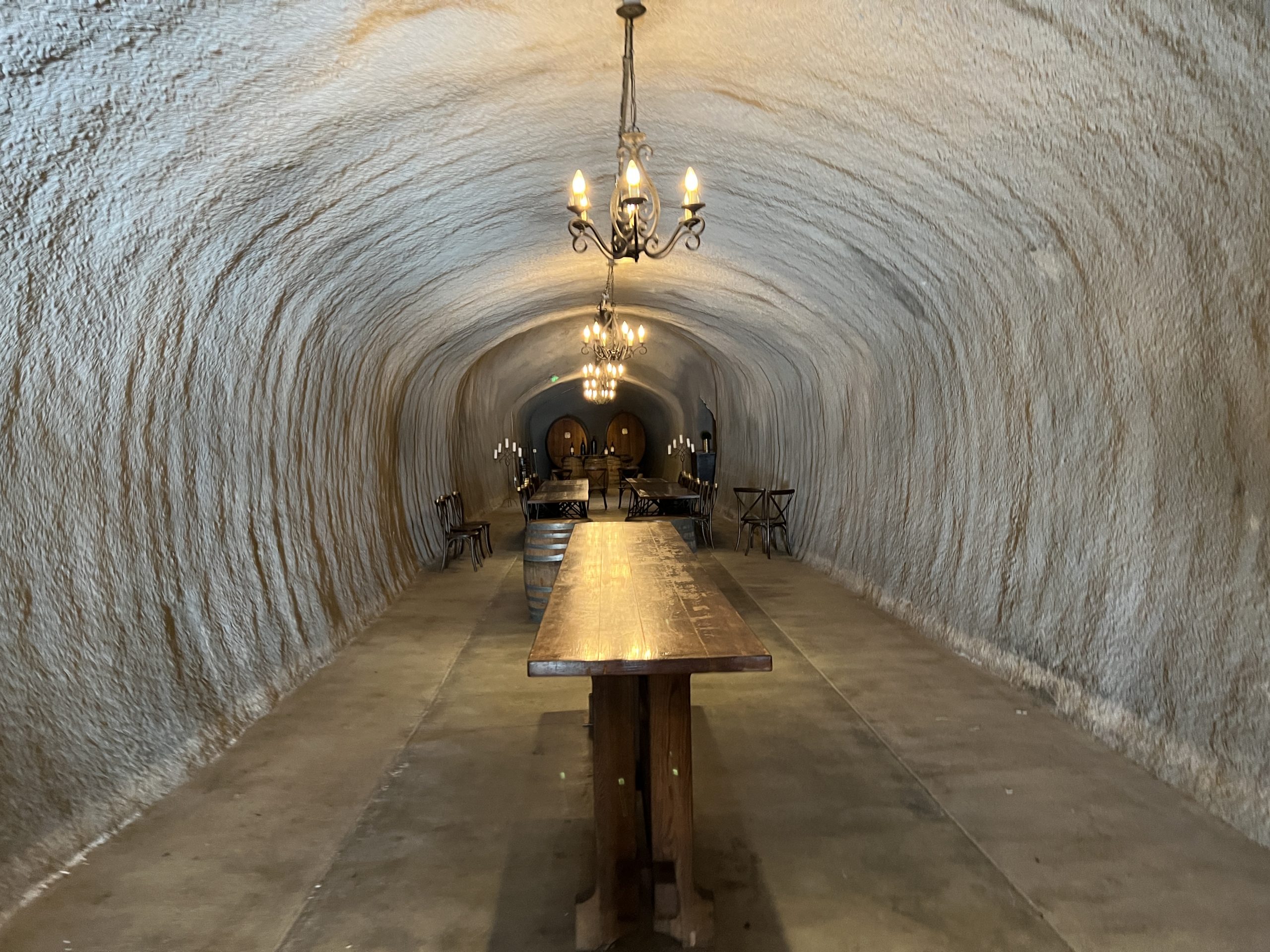 A long table in the middle of an underground tunnel.