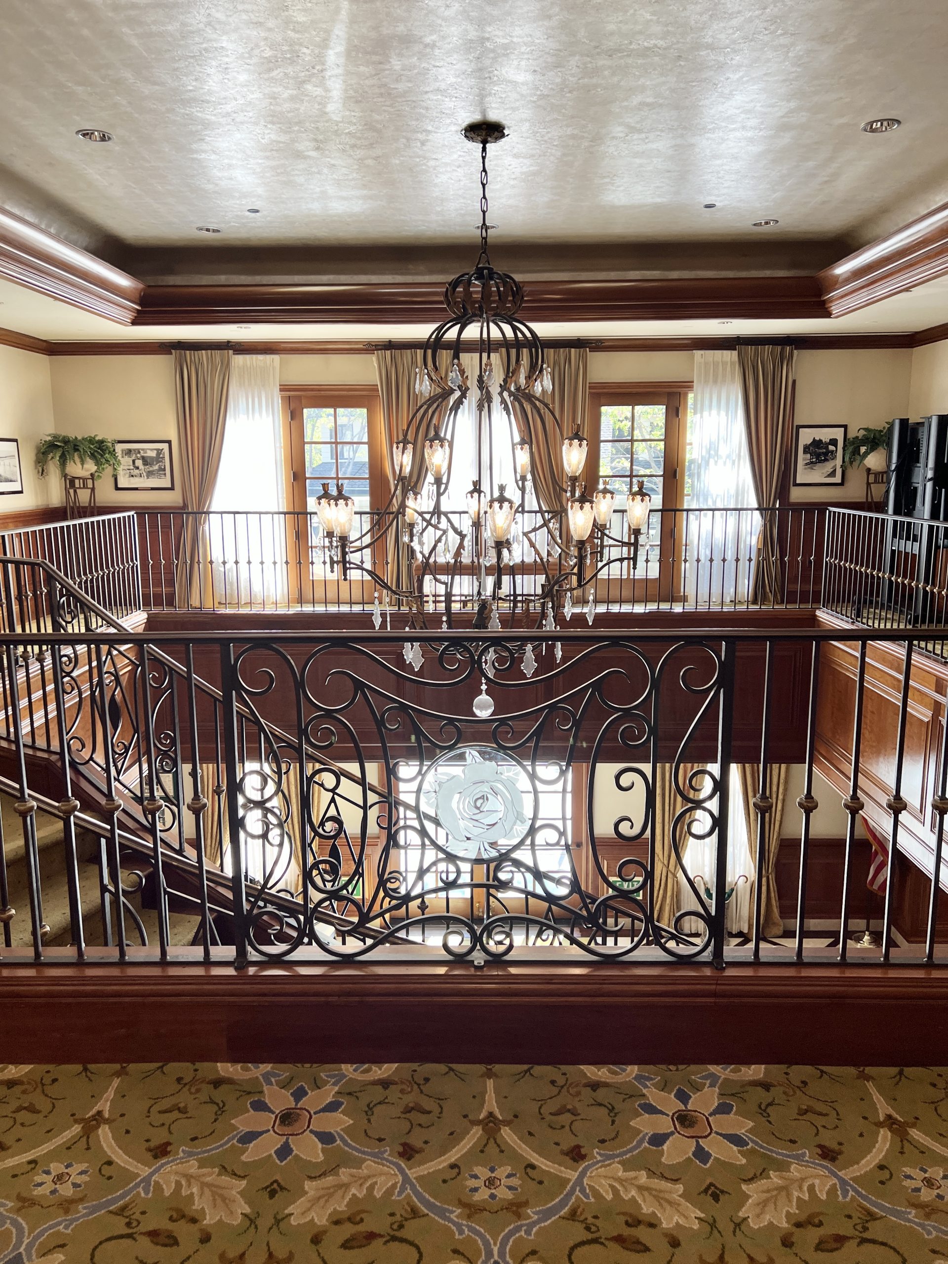 A large staircase with wrought iron railings.