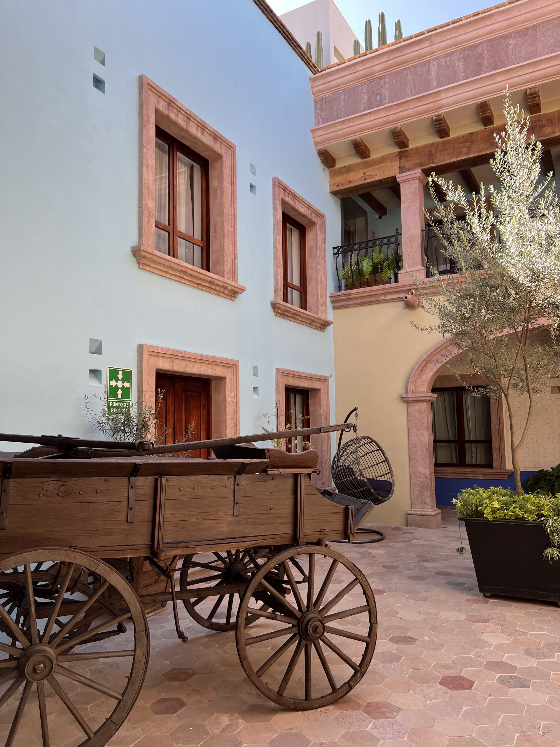 A wooden cart in front of a building.