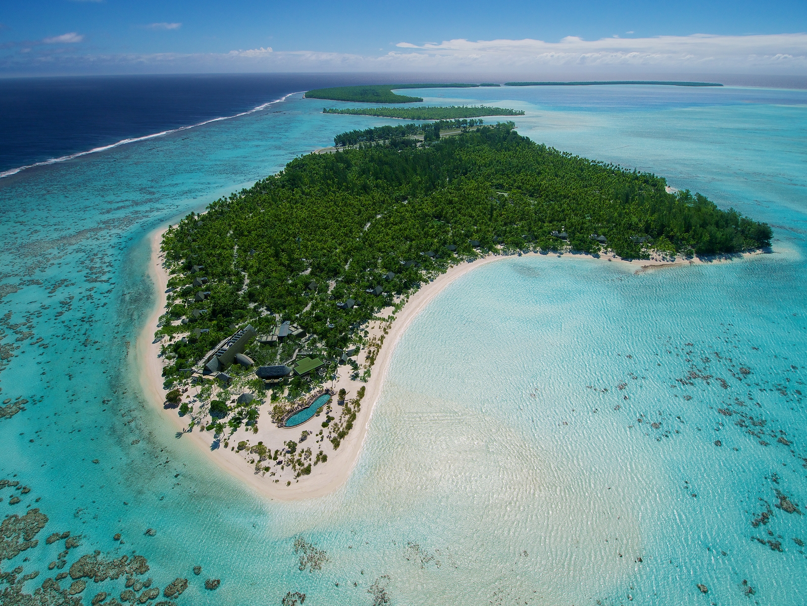 A small island in the middle of an ocean.