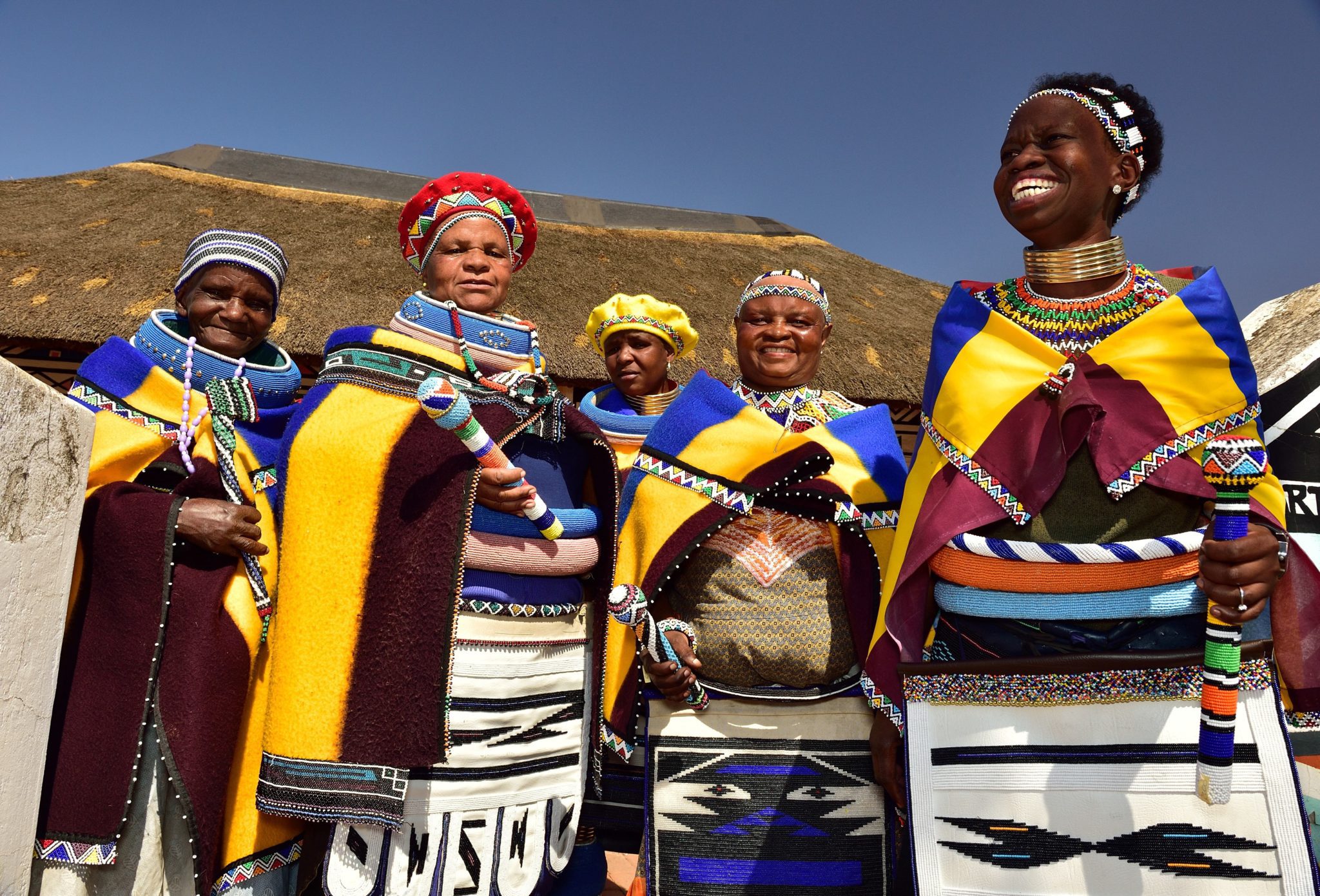 A group of people in traditional dress standing together.