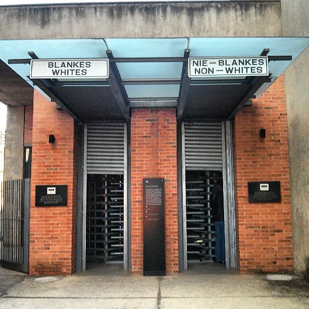 A building with two doors and a metal roof.