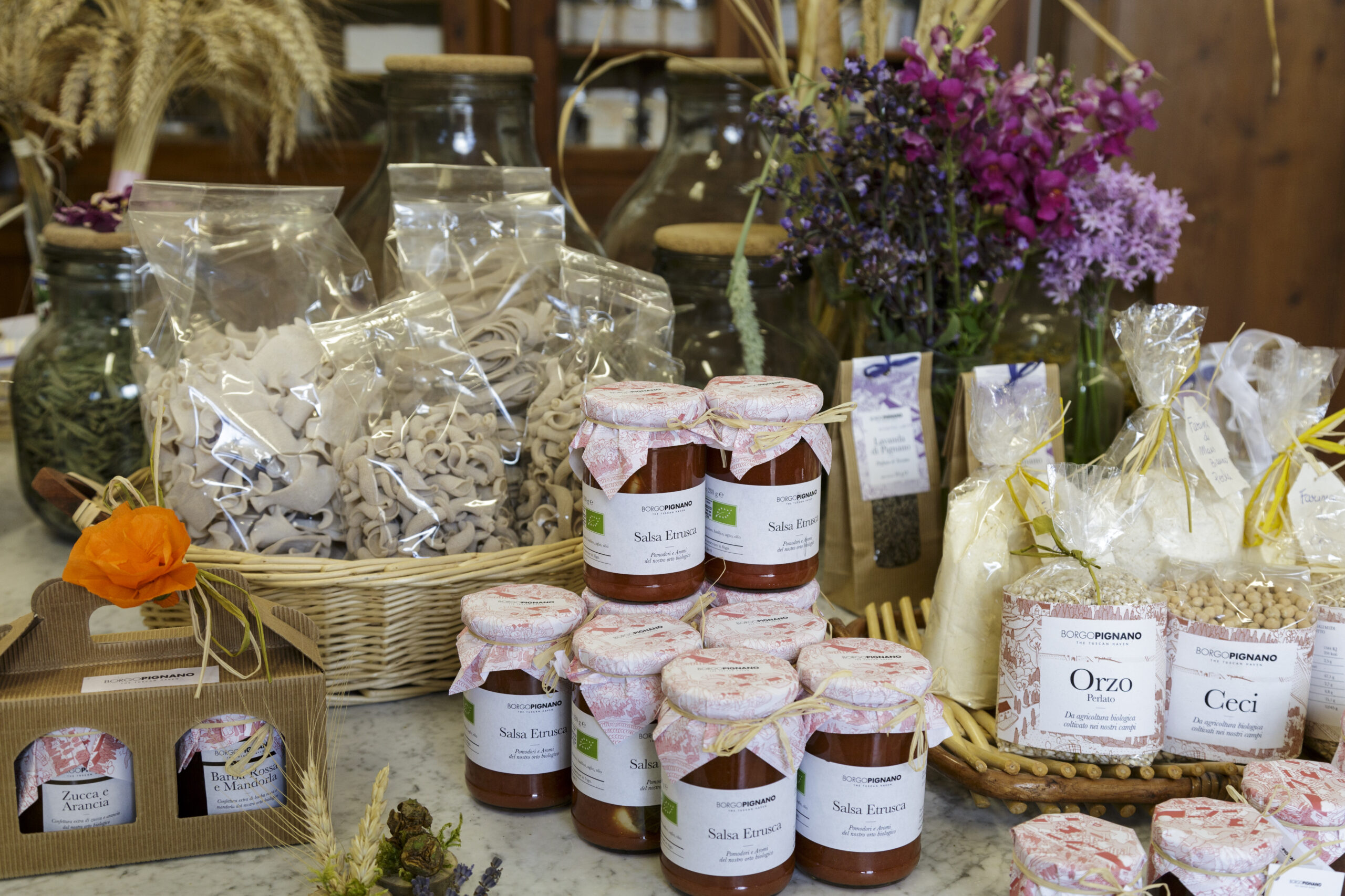 A table with many jars of food on it