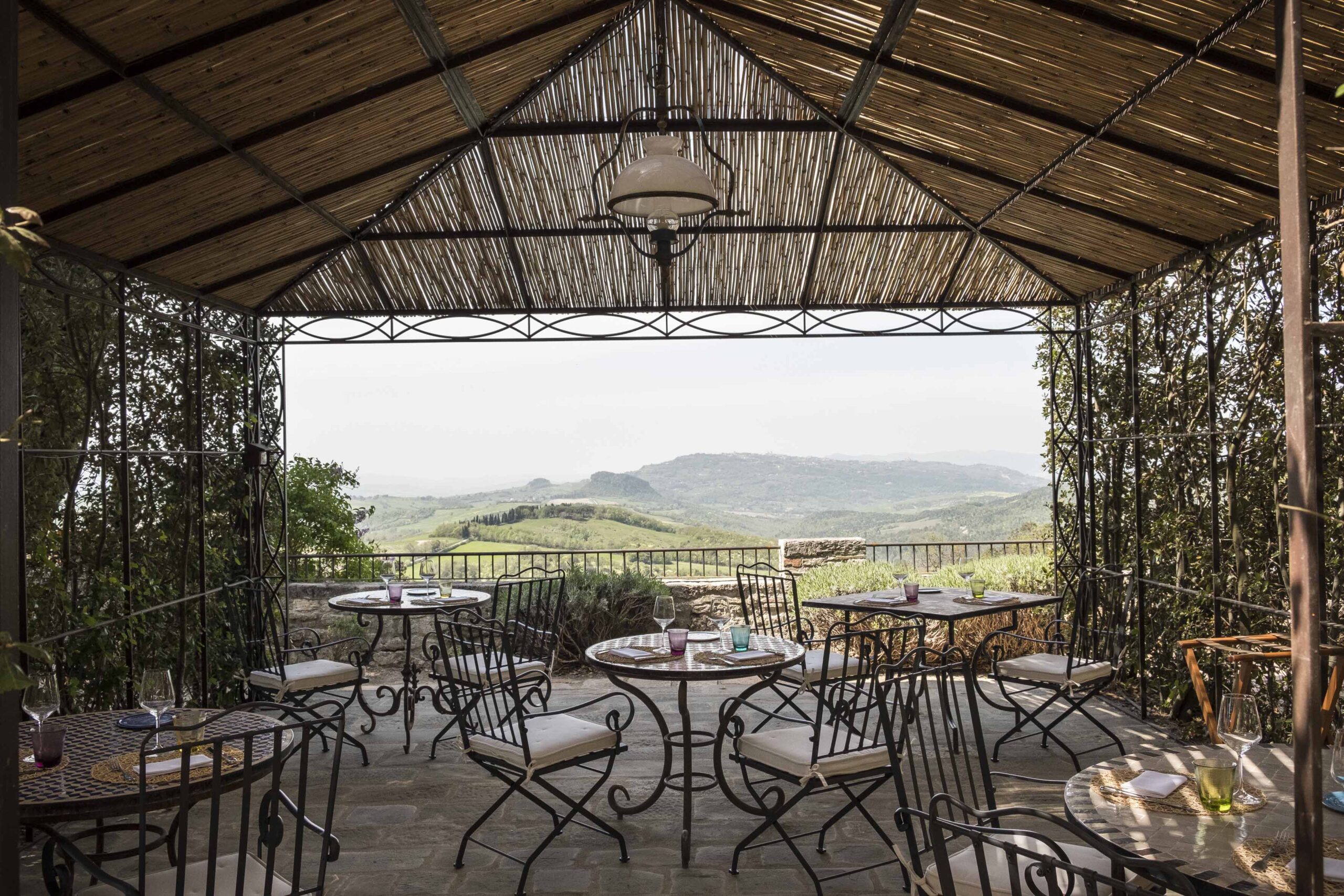 A restaurant with tables and chairs in the middle of it