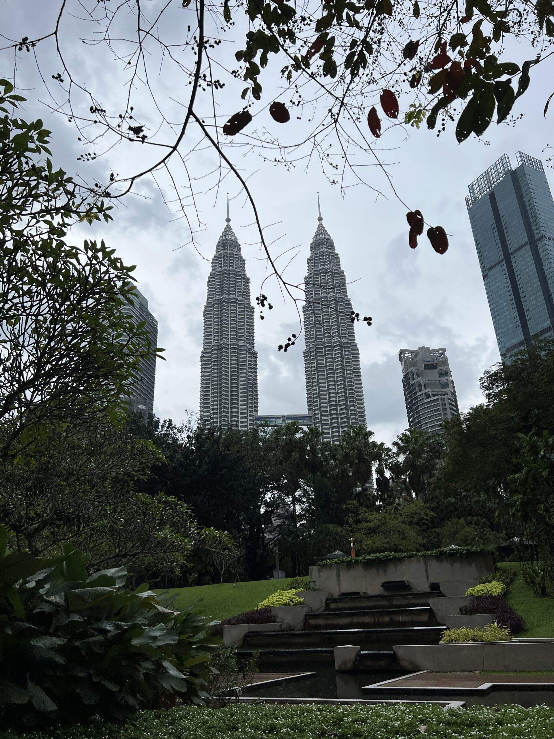 A view of three tall buildings from the ground.