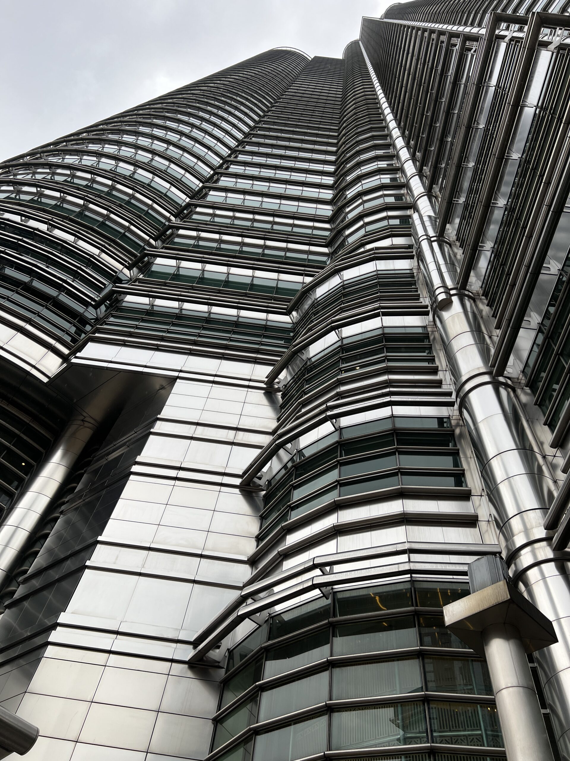 A tall building with many windows and glass