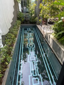 A long pool with a blue and white pattern on it