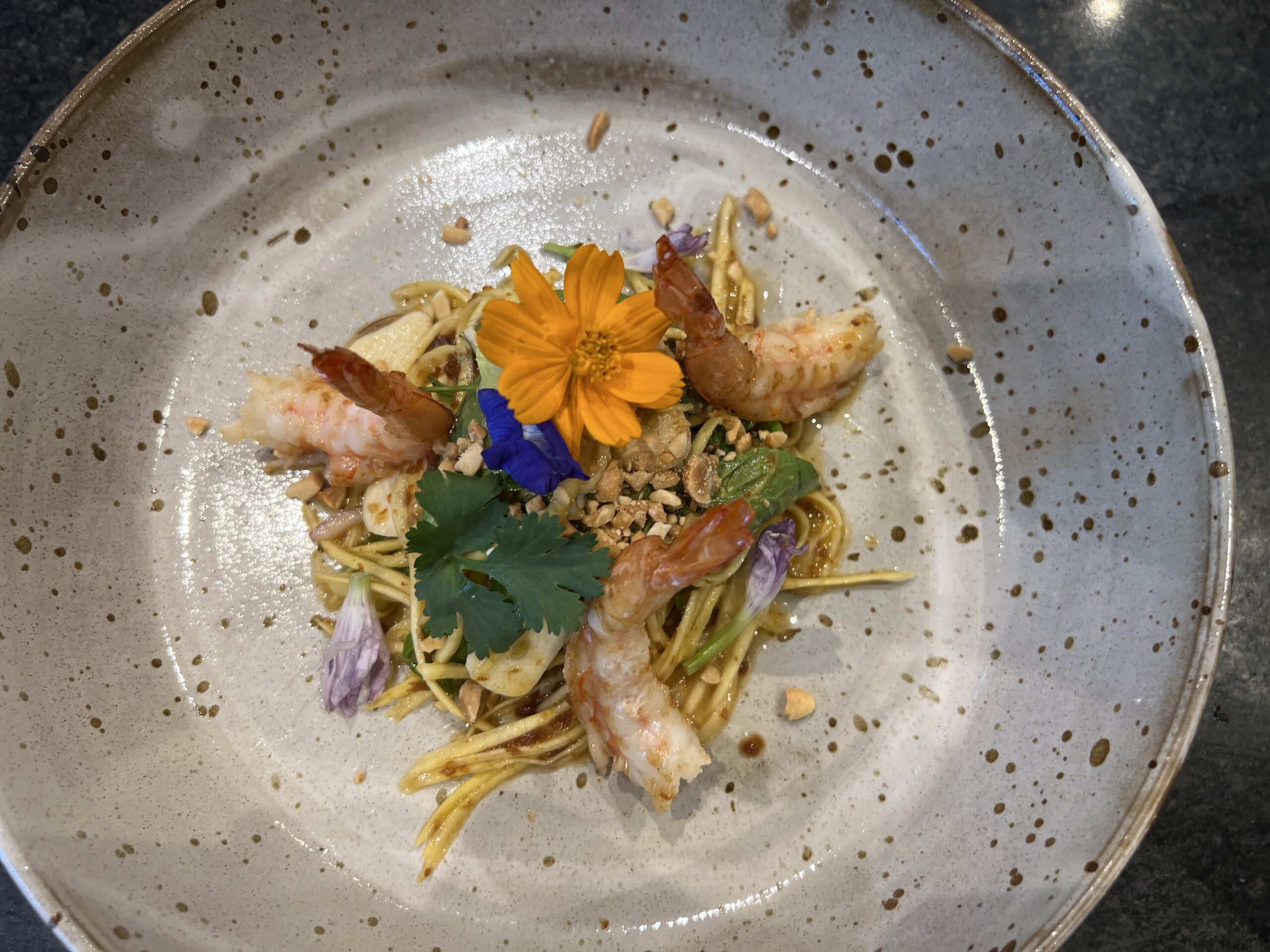 A plate of food with some flowers on it