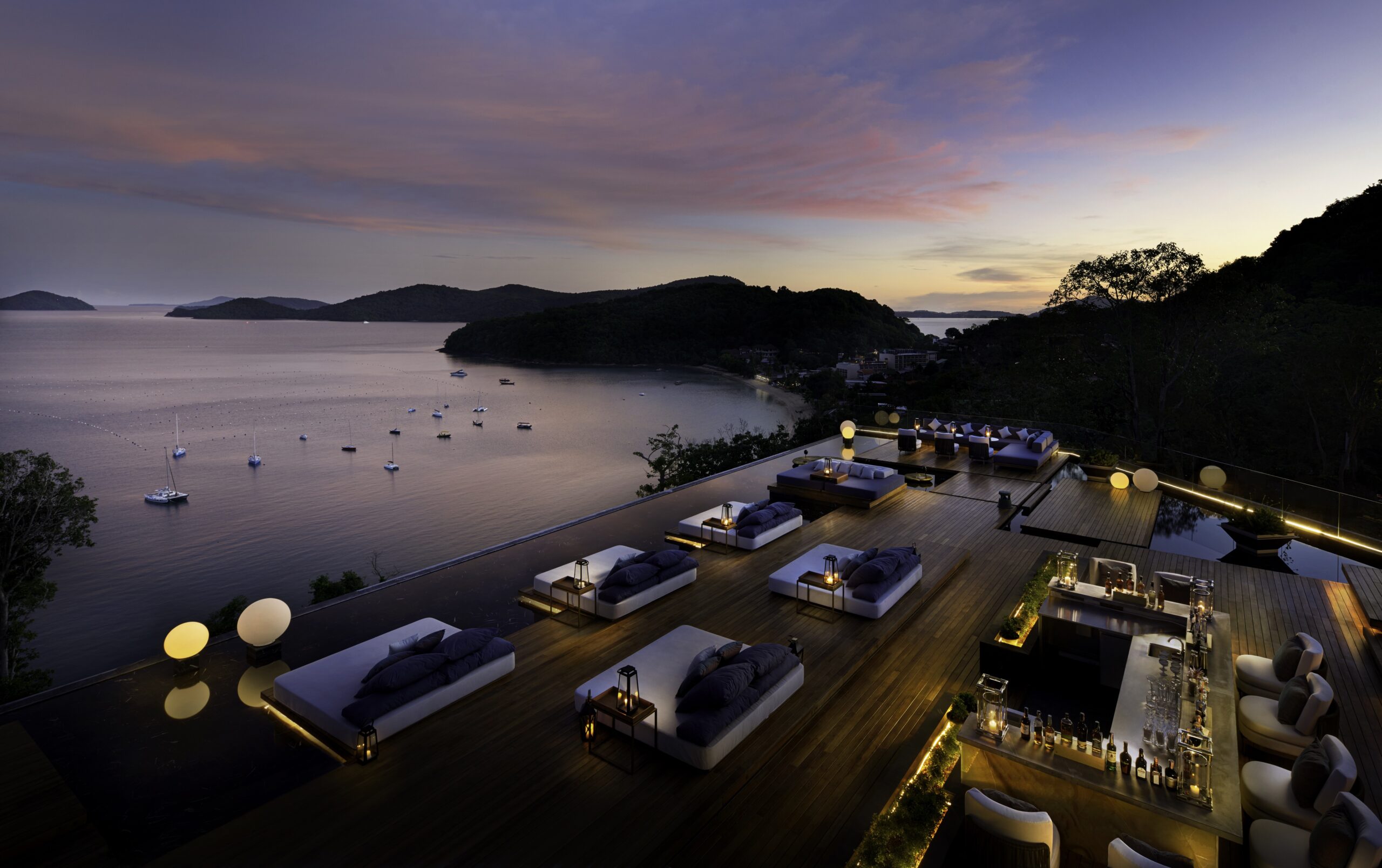 A group of cars parked on top of a dock.