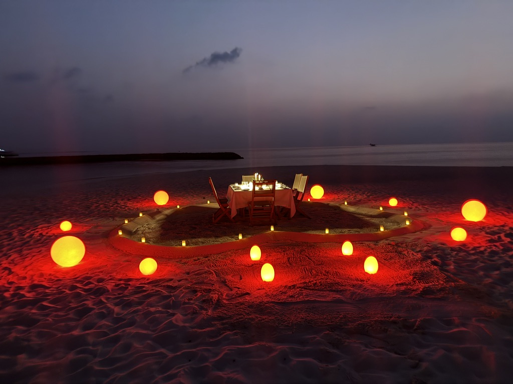 A table with candles on the beach