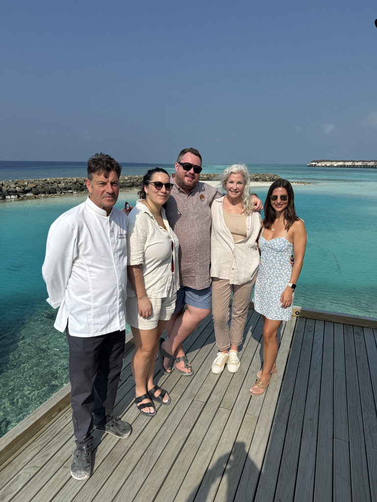 A group of people standing on the dock