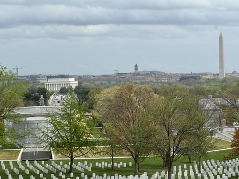 A view of the washington monument from arlington cemetery.
