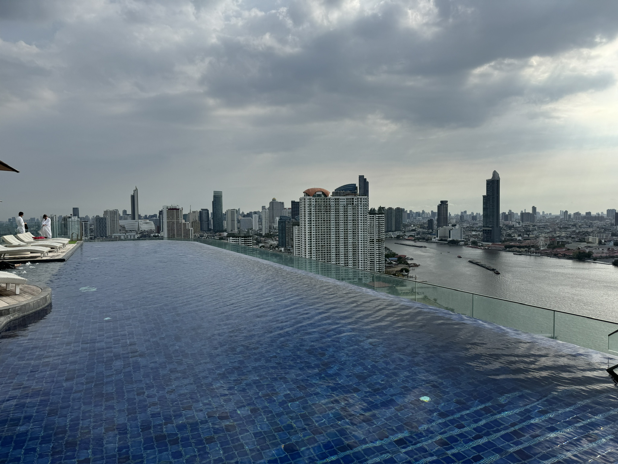 A pool with a view of the city skyline.