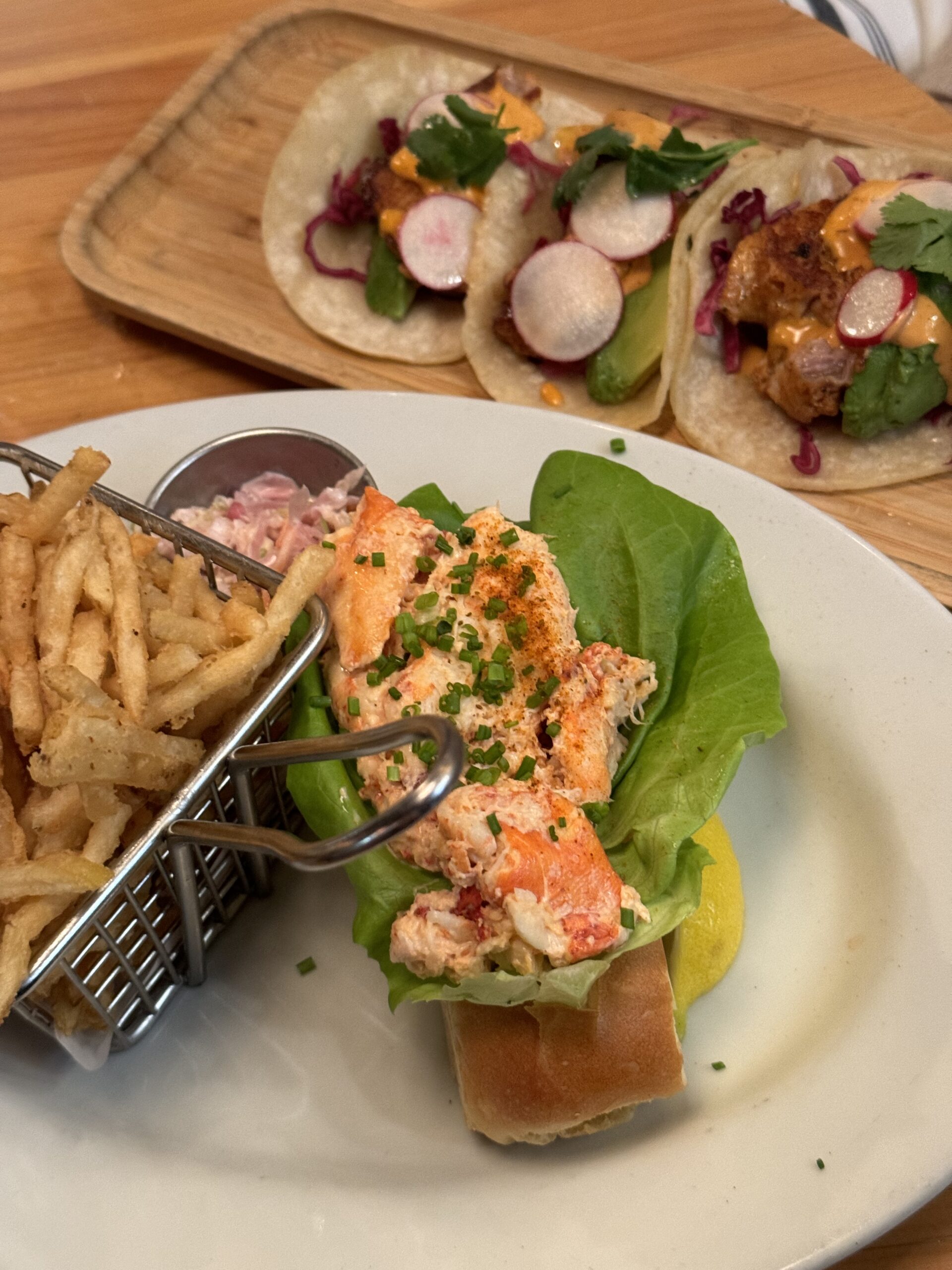 A plate of food with some fries and salad